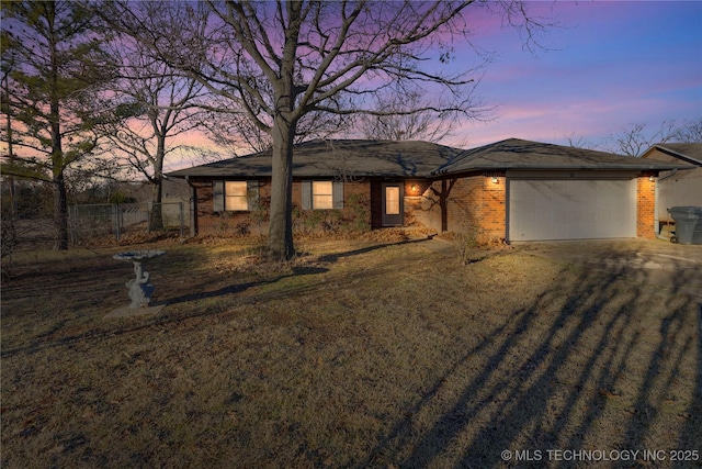 single story home featuring a garage