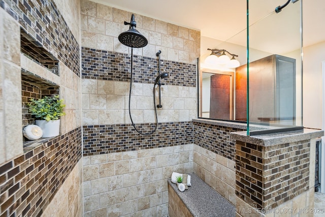 bathroom featuring a tile shower