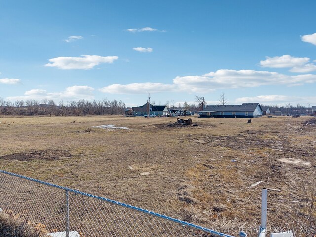 view of yard with a rural view