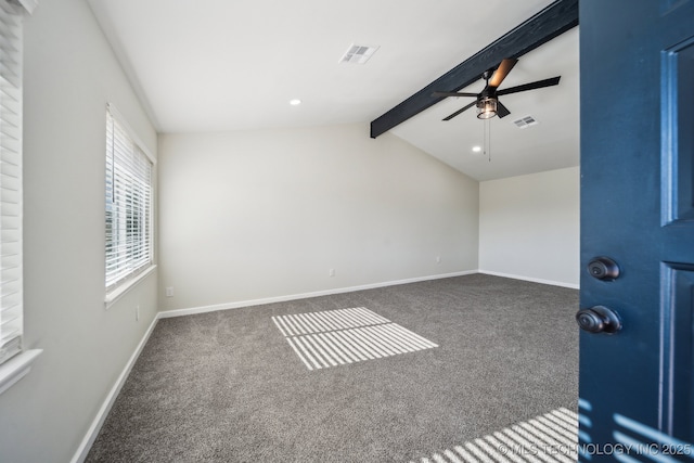 unfurnished room featuring vaulted ceiling with beams, ceiling fan, and dark colored carpet