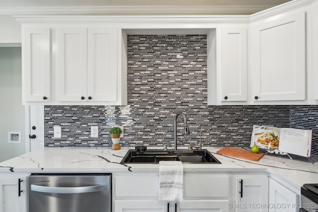 kitchen featuring white cabinetry, sink, and decorative backsplash