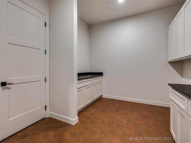 laundry room featuring baseboards