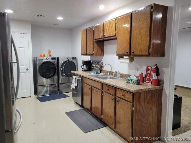 109 S E St, Eufaula, OK 74432 - kitchen with sink, independent washer and dryer, and appliances with stainless steel finishes