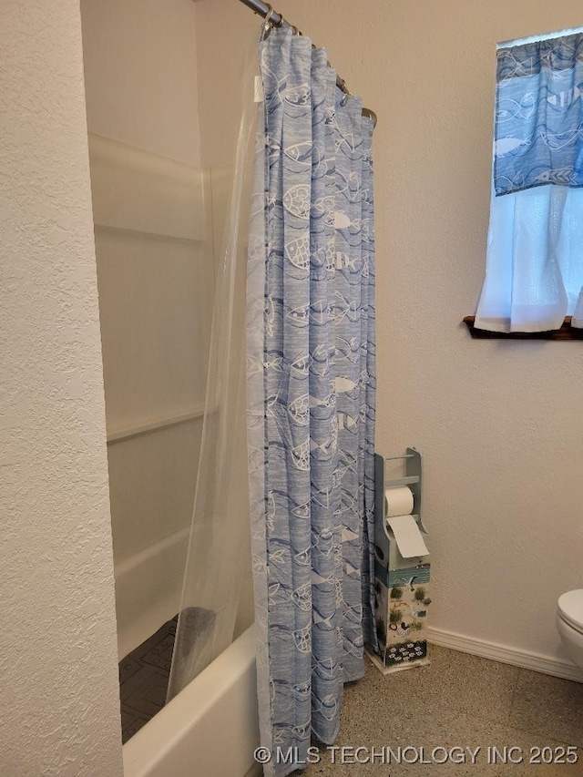 bathroom with toilet and shower / bathtub combination with curtain