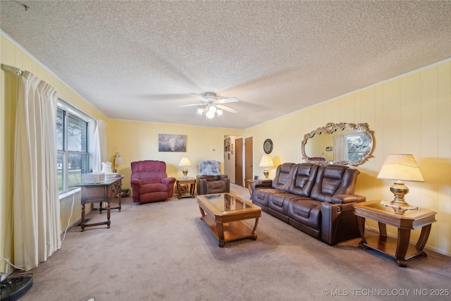 carpeted living room with a textured ceiling and ceiling fan