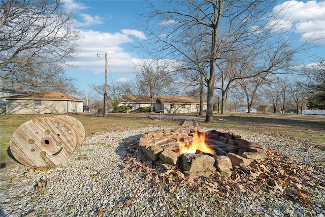 view of yard featuring a fire pit