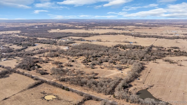 birds eye view of property with a rural view