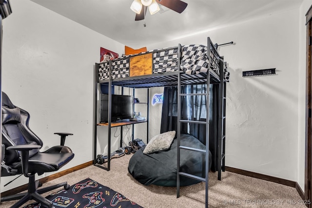 bedroom with ceiling fan and carpet floors