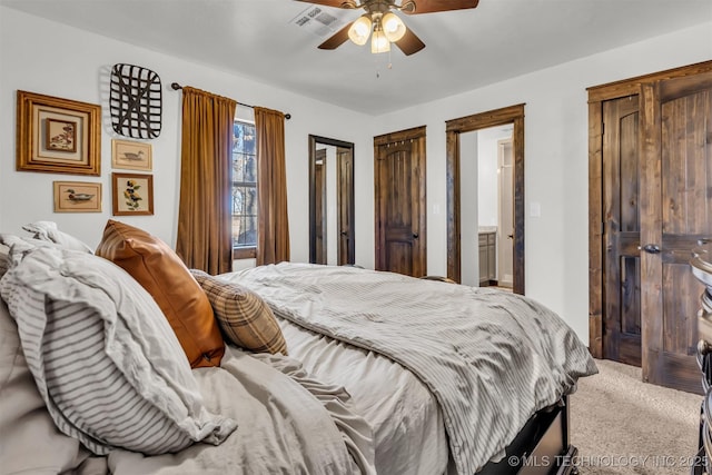 carpeted bedroom with ceiling fan