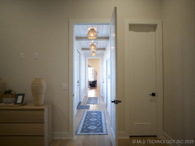 corridor with light wood-type flooring