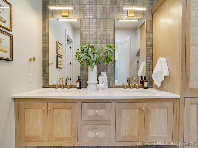 full bathroom featuring double vanity and a sink