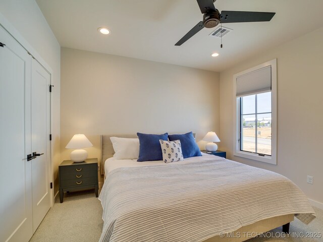 bedroom featuring light carpet, ceiling fan, visible vents, and recessed lighting