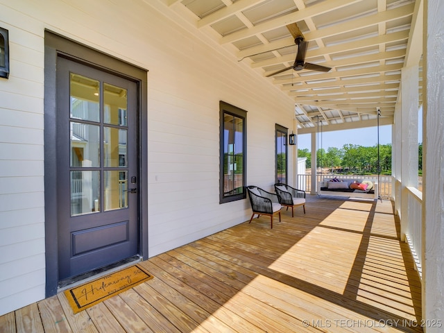 deck featuring ceiling fan and a porch