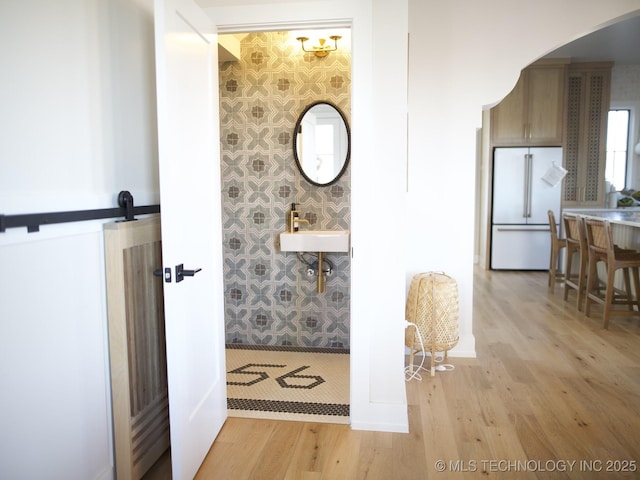 bathroom with wood-type flooring