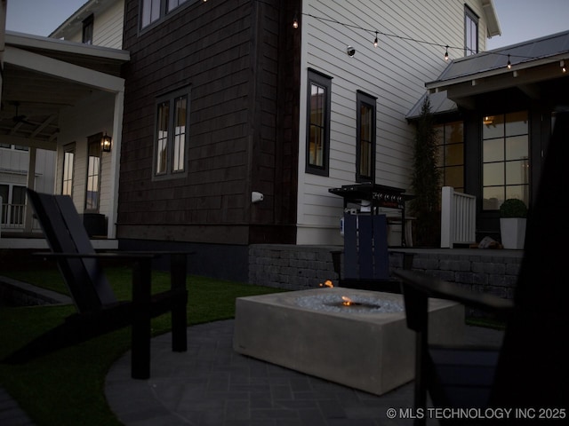 view of patio featuring an outdoor fire pit