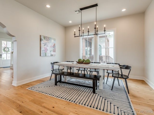 56 Center Ln N, Carlton Landing, OK 74432 - dining room with light wood-style floors, recessed lighting, arched walkways, and a chandelier