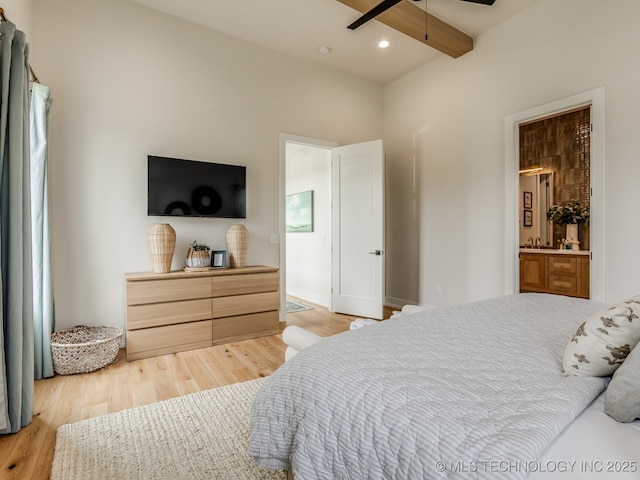 56 Center Ln N, Carlton Landing, OK 74432 - bedroom with light wood finished floors, ensuite bath, and beam ceiling