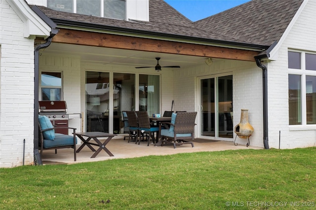 back of house with a yard, a patio, and ceiling fan