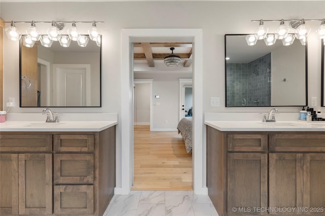 bathroom with beamed ceiling, vanity, coffered ceiling, and walk in shower