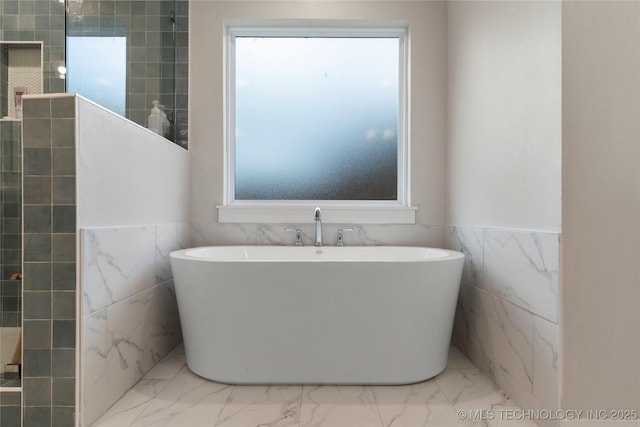 bathroom featuring independent shower and bath and tile walls