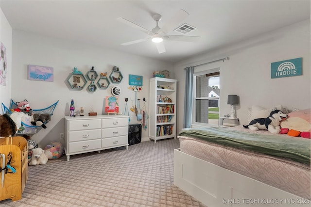 bedroom with ceiling fan and light carpet