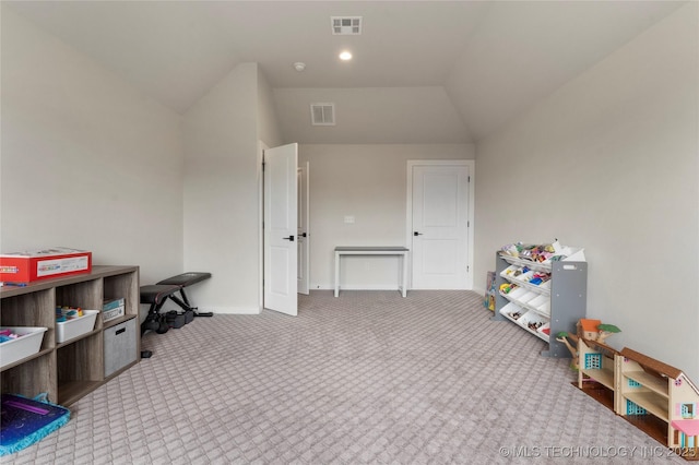 recreation room with vaulted ceiling and light colored carpet