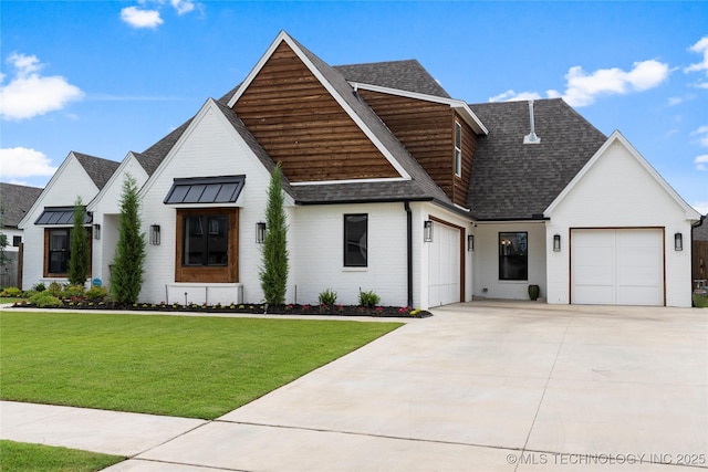 modern farmhouse with a front yard and a garage