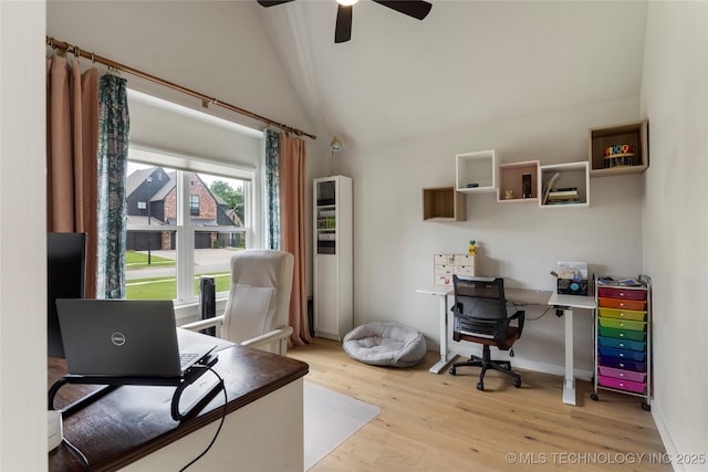 office featuring vaulted ceiling, ceiling fan, and light hardwood / wood-style flooring