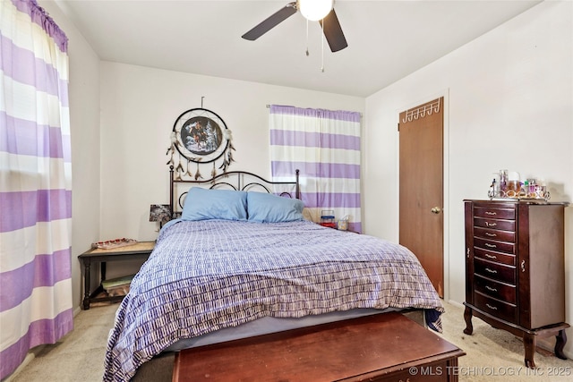 bedroom featuring light carpet and ceiling fan