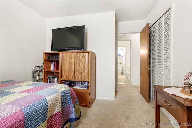 carpeted bedroom featuring a closet