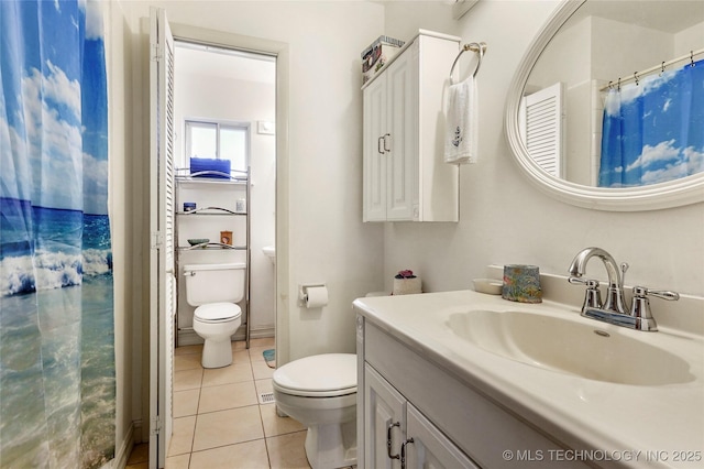 bathroom with toilet, tile patterned flooring, a shower with shower curtain, and vanity