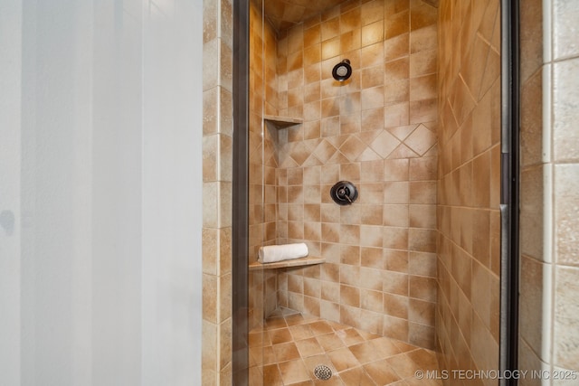 bathroom with tiled shower