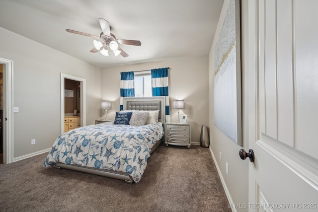 bedroom featuring ensuite bathroom, dark carpet, and ceiling fan