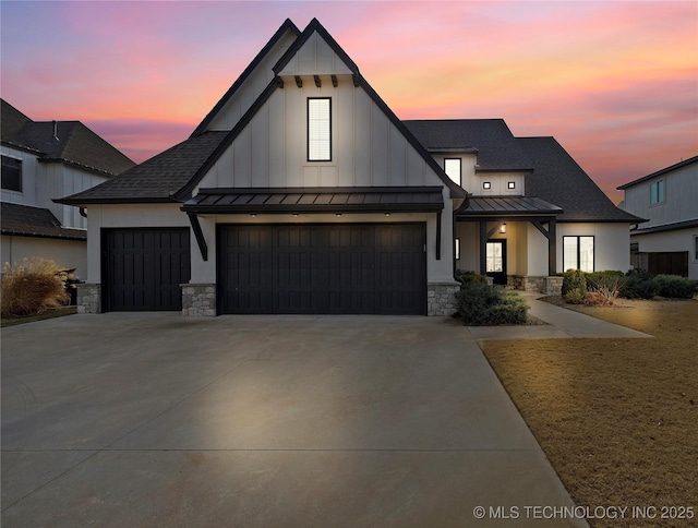 modern farmhouse style home featuring a garage