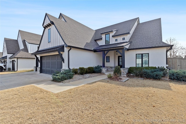 view of front of home with a porch, a garage, and a front lawn