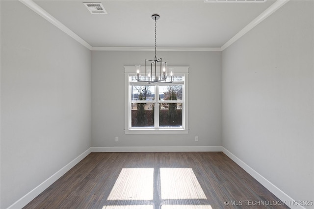 unfurnished dining area with crown molding, dark hardwood / wood-style floors, and a chandelier