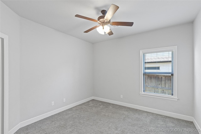 unfurnished room with ceiling fan and light carpet