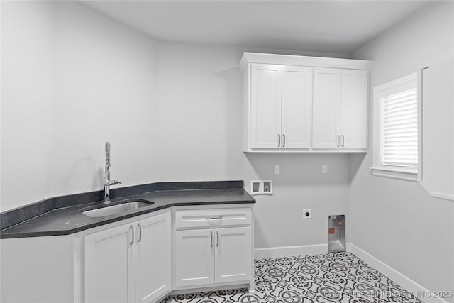 clothes washing area featuring sink, cabinets, light tile patterned floors, hookup for a washing machine, and electric dryer hookup