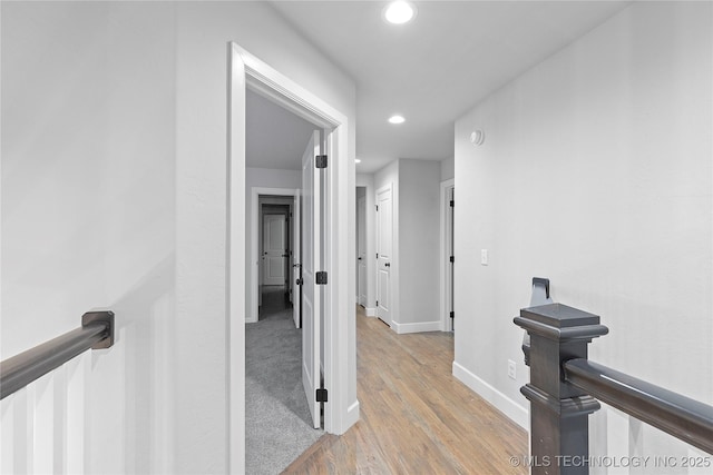 corridor featuring light hardwood / wood-style floors