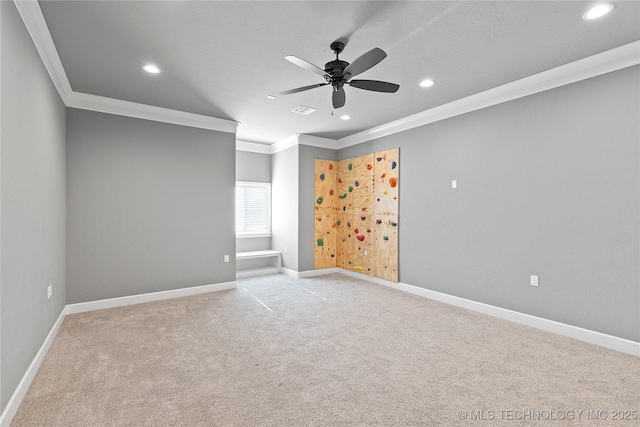 unfurnished room featuring crown molding, light carpet, and ceiling fan