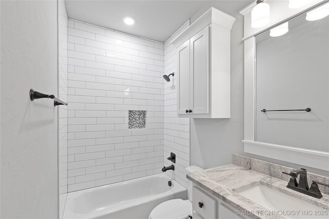 full bathroom with tiled shower / bath combo, vanity, and toilet