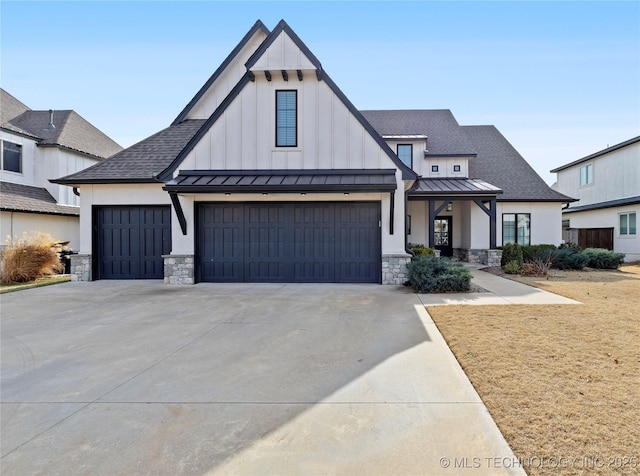 modern inspired farmhouse with a garage