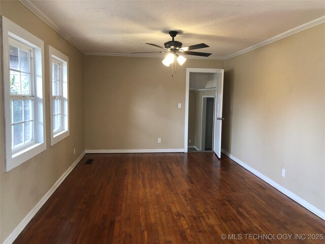 empty room with dark wood-type flooring, ceiling fan, crown molding, and a textured ceiling