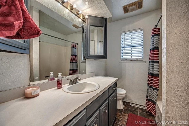 full bathroom with vanity, shower / bath combo with shower curtain, a textured ceiling, and toilet