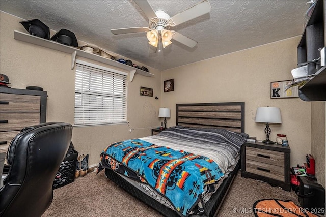 carpeted bedroom with a textured ceiling and ceiling fan