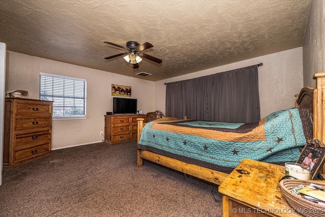 bedroom featuring carpet flooring, a textured ceiling, and ceiling fan