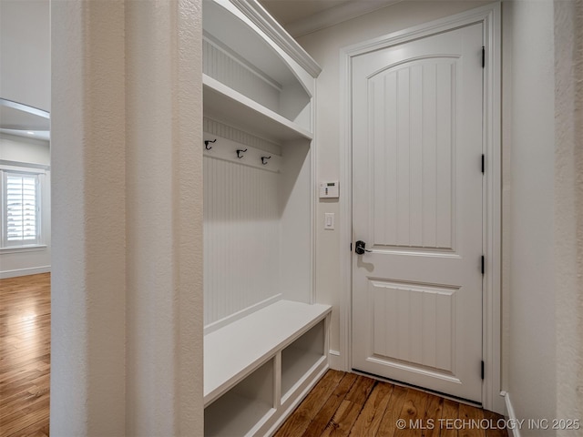 mudroom featuring hardwood / wood-style floors and ornamental molding