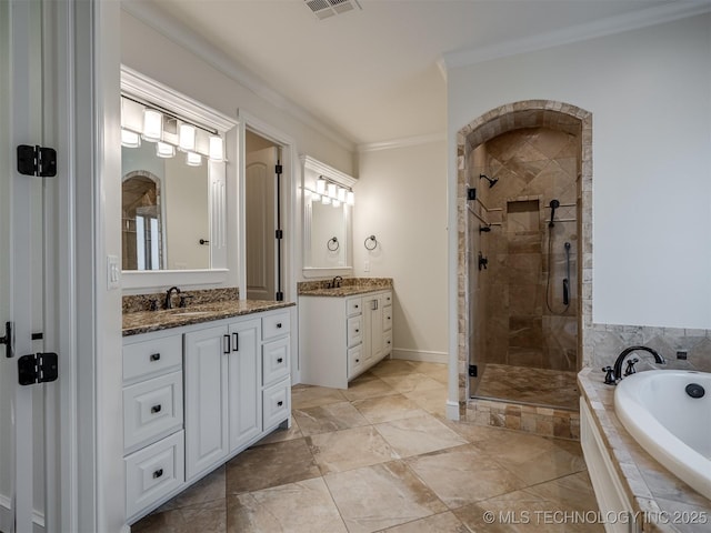 bathroom with ornamental molding, separate shower and tub, and vanity