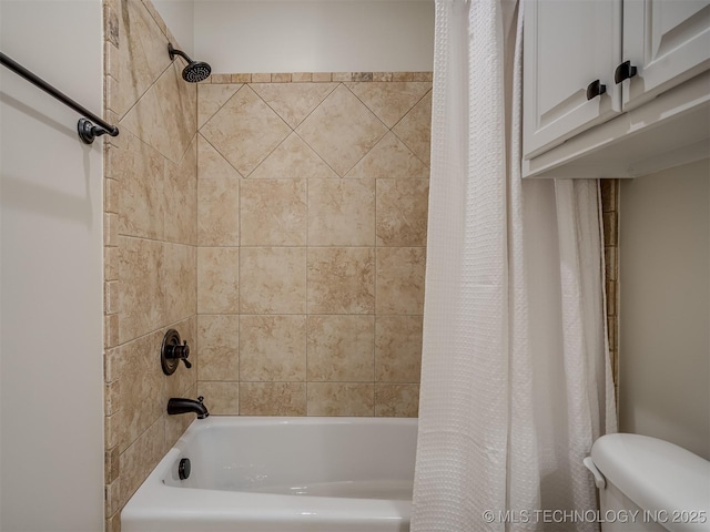 bathroom with shower / bath combination with curtain and toilet