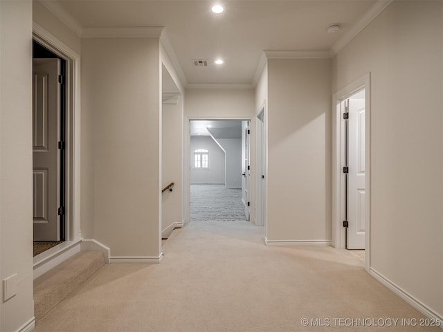 corridor with light carpet and crown molding